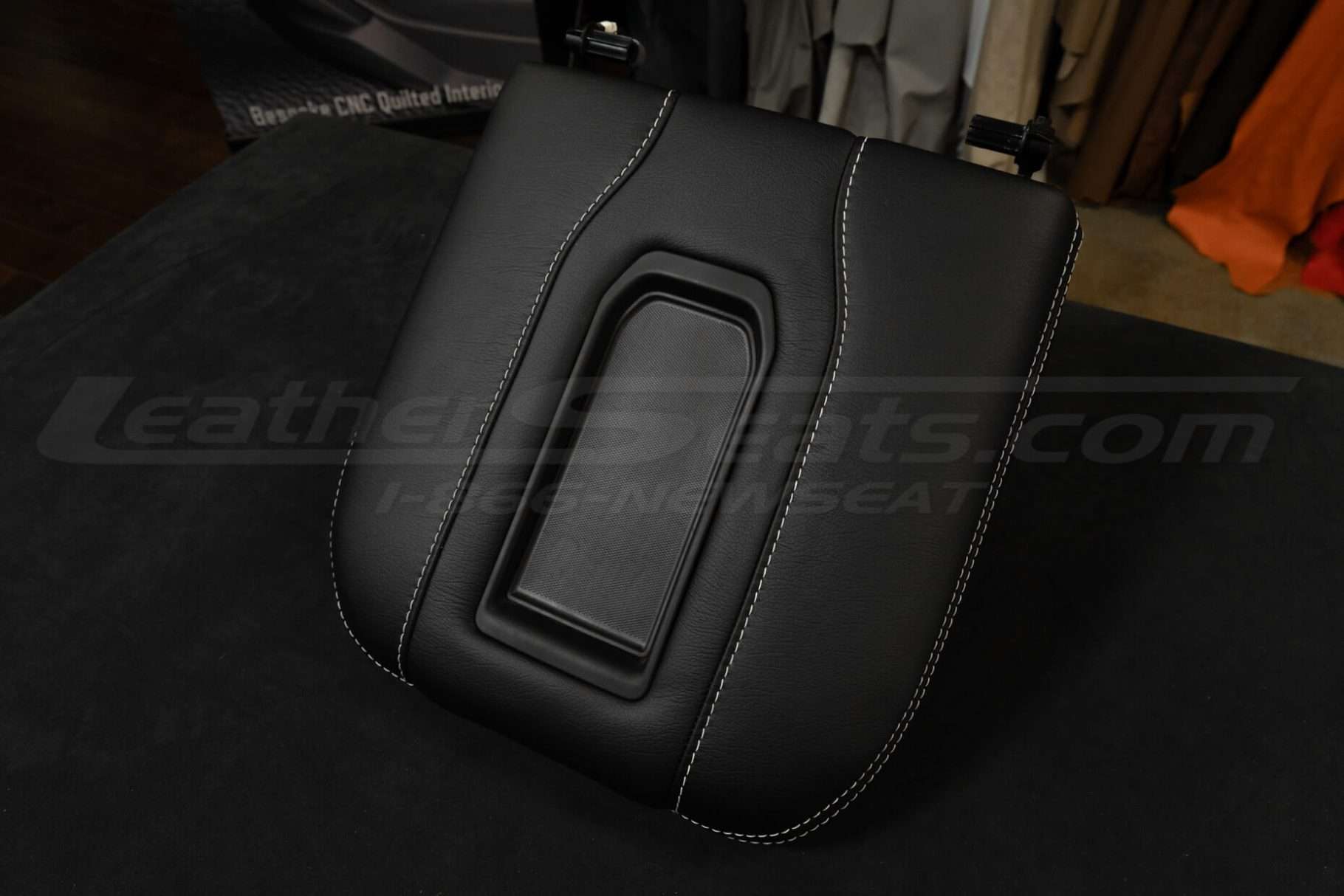 Top-down side view of aftermarket chevy and gmc leather console cover