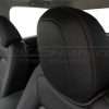 Black leather headrest close-up with contrastin gstitching in Cardinal