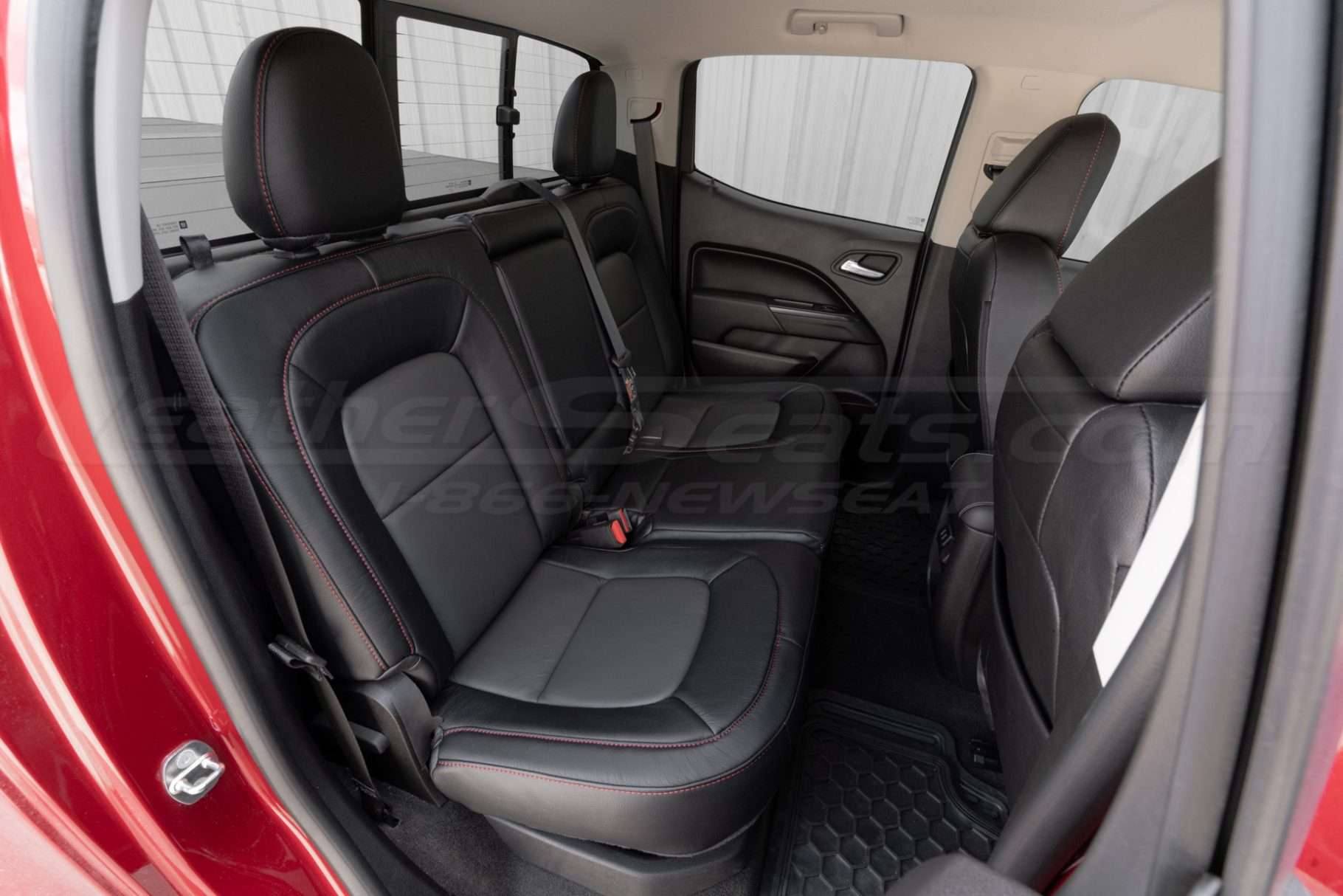 Passenger side view of rear installed leather seats for Chevy Colorado trucks