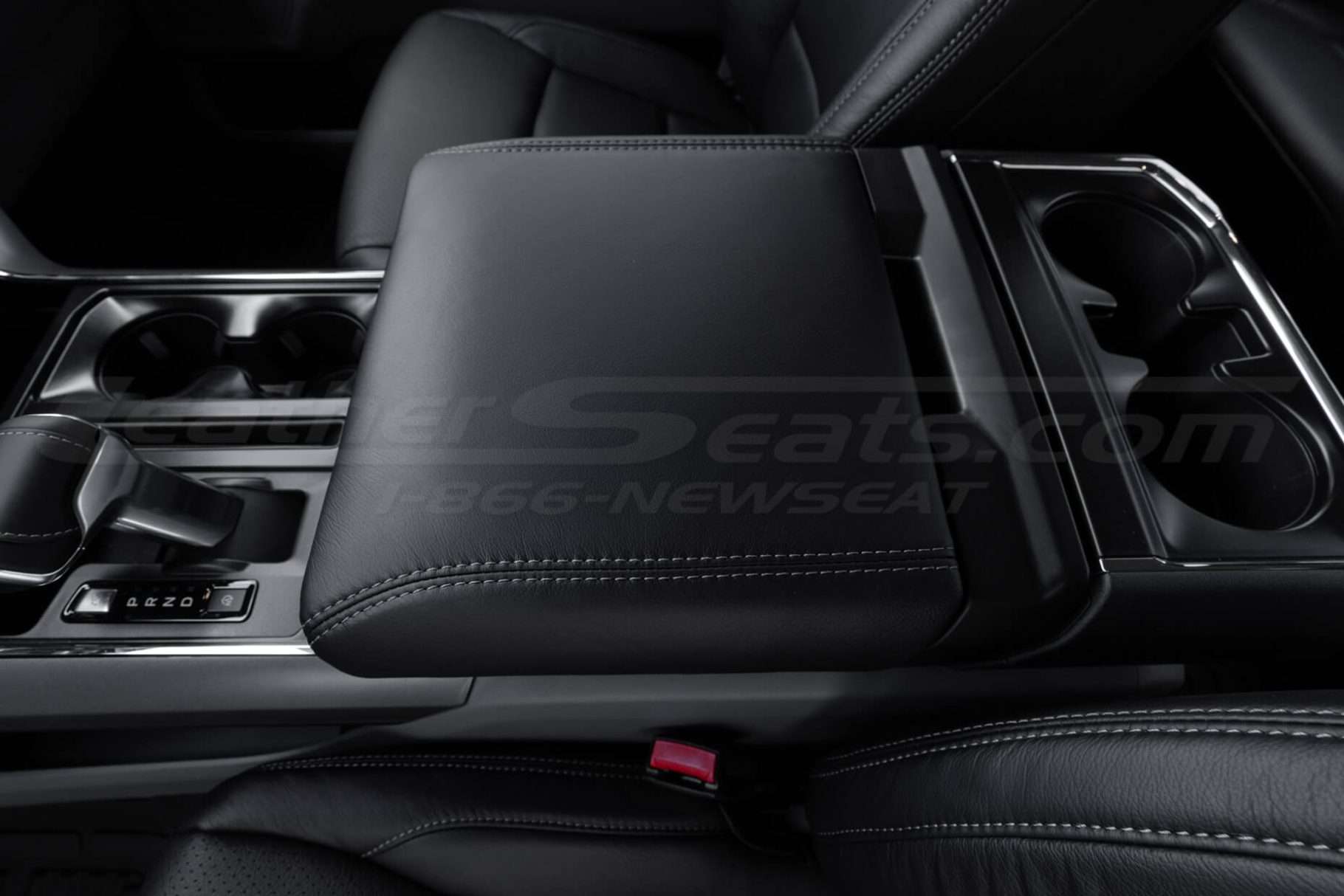 Driver side close-up of installed leather console lid cover