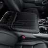 Passenger side view of installed black leather console lid cover