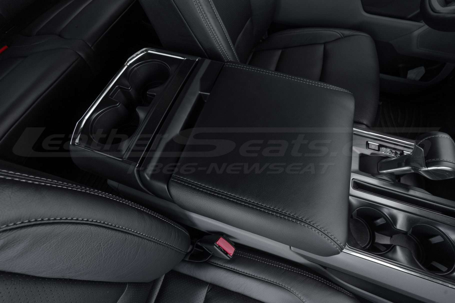 Passenger sid close-up of black leather console lid cover for Ford F-150