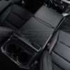 Top-down passenger view of work surface console flat lay