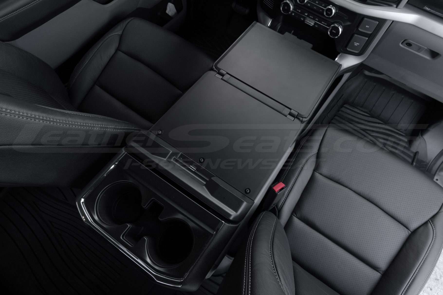 Top-down passenger view of work surface console flat lay