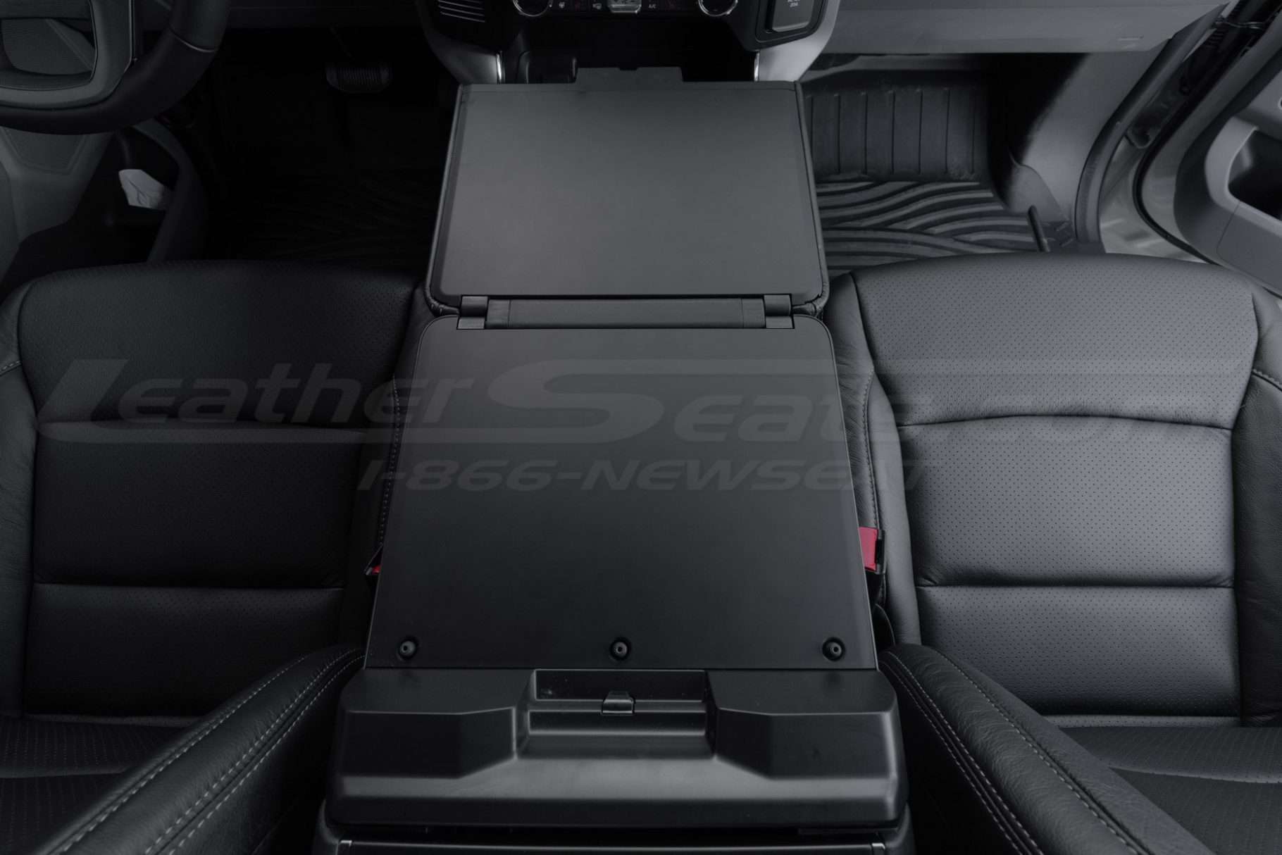 View from the rear seats of work surface console