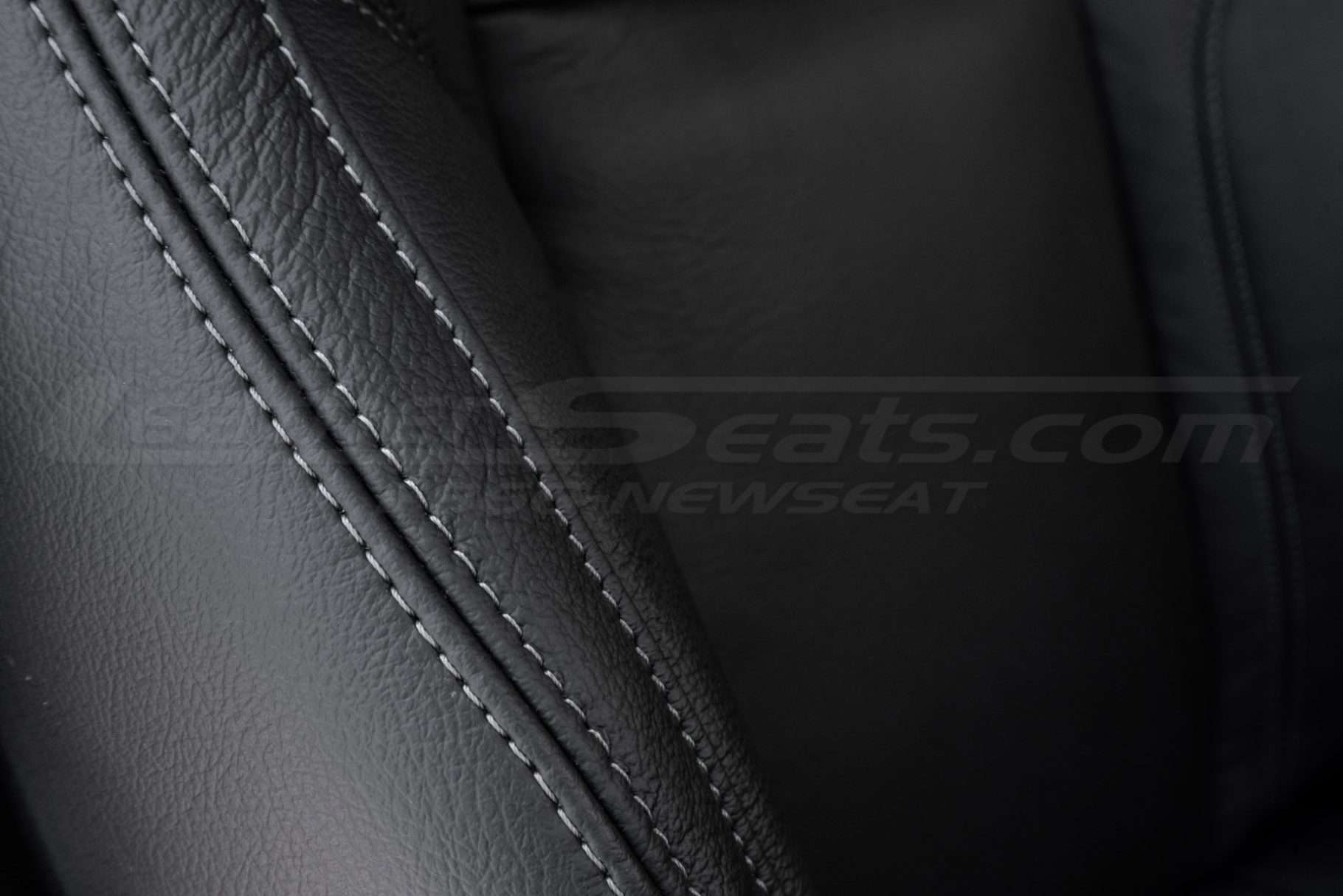 Contrasting grey thread on Black leather
