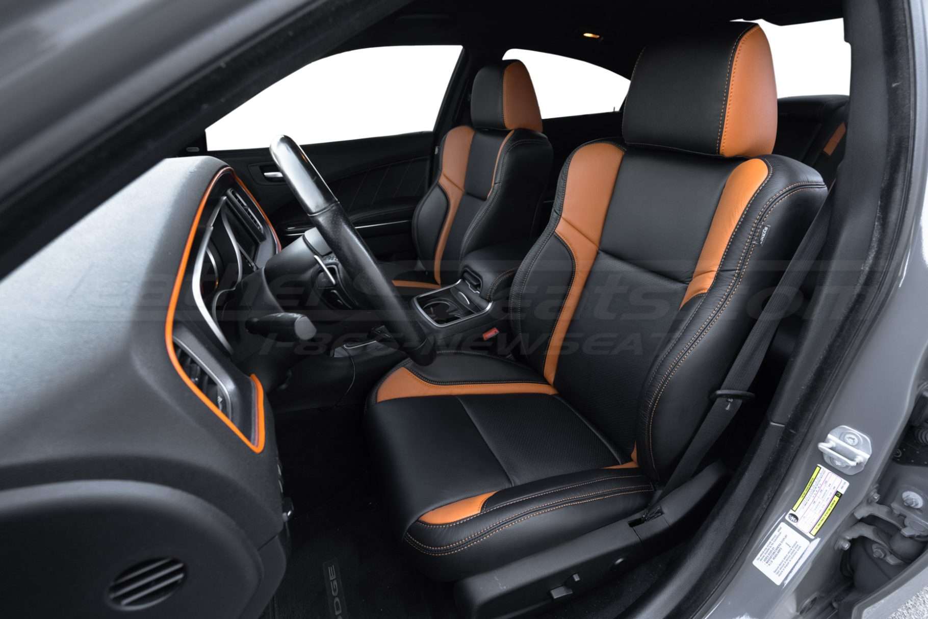 Dodge Charger installed leather seats in Black with Orange wings - Front driver seat