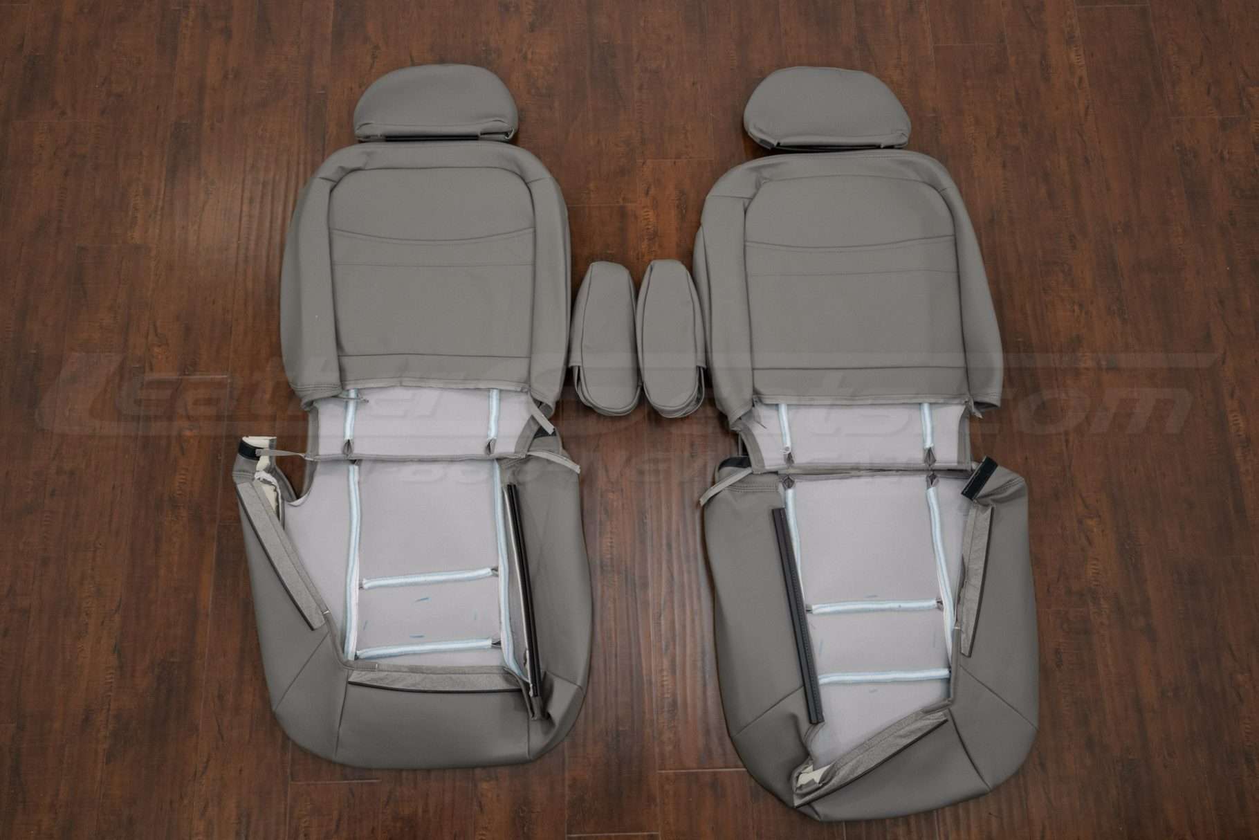 Back view of front seat upholstery and armrests