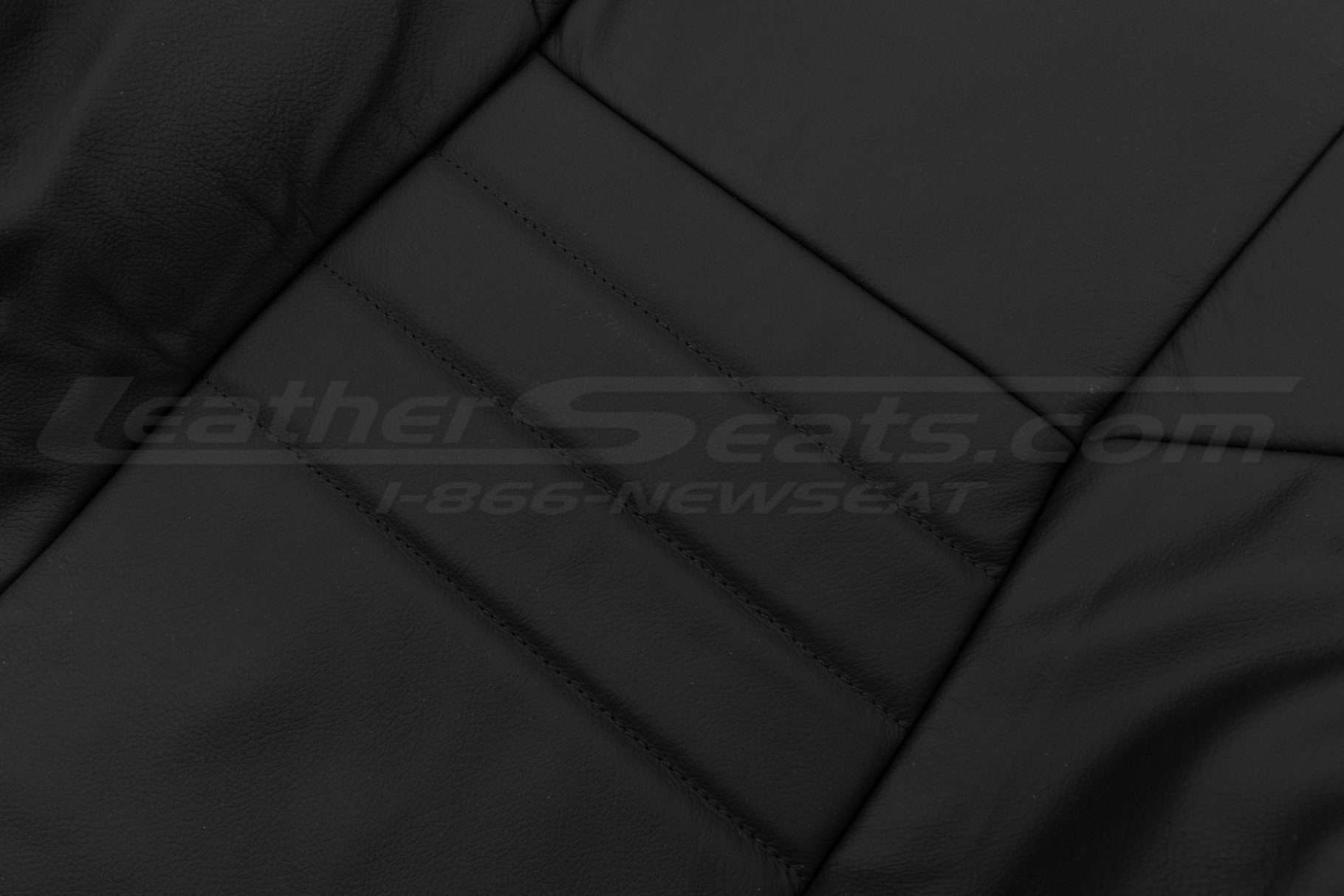 Dodge Charger black leather texture close-up