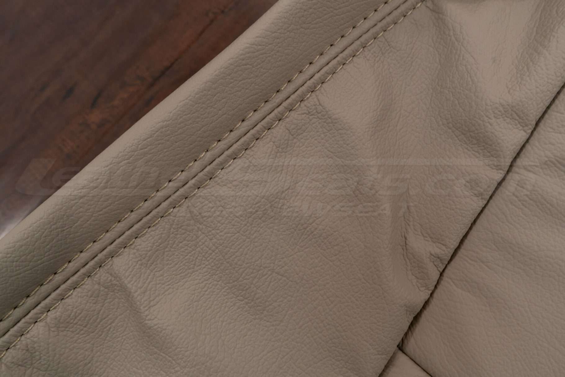 Ivory double-stitching on ivory leather