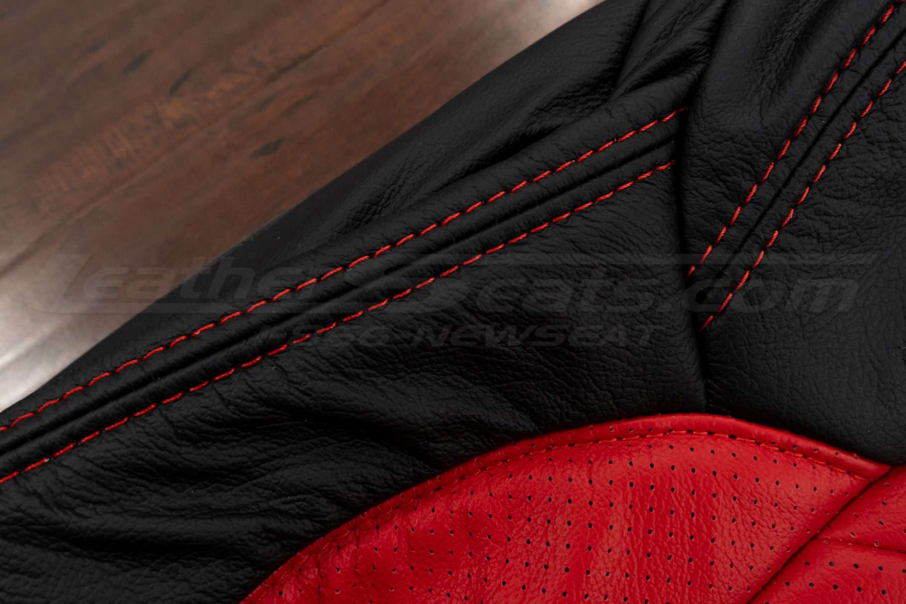 Contrasting Bright Red stitching on Black leather