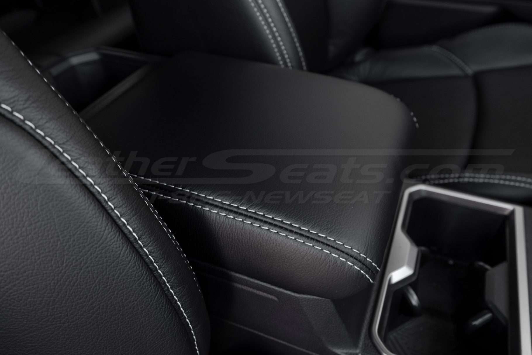Tacoma double cab leather console lid cover installed close-up