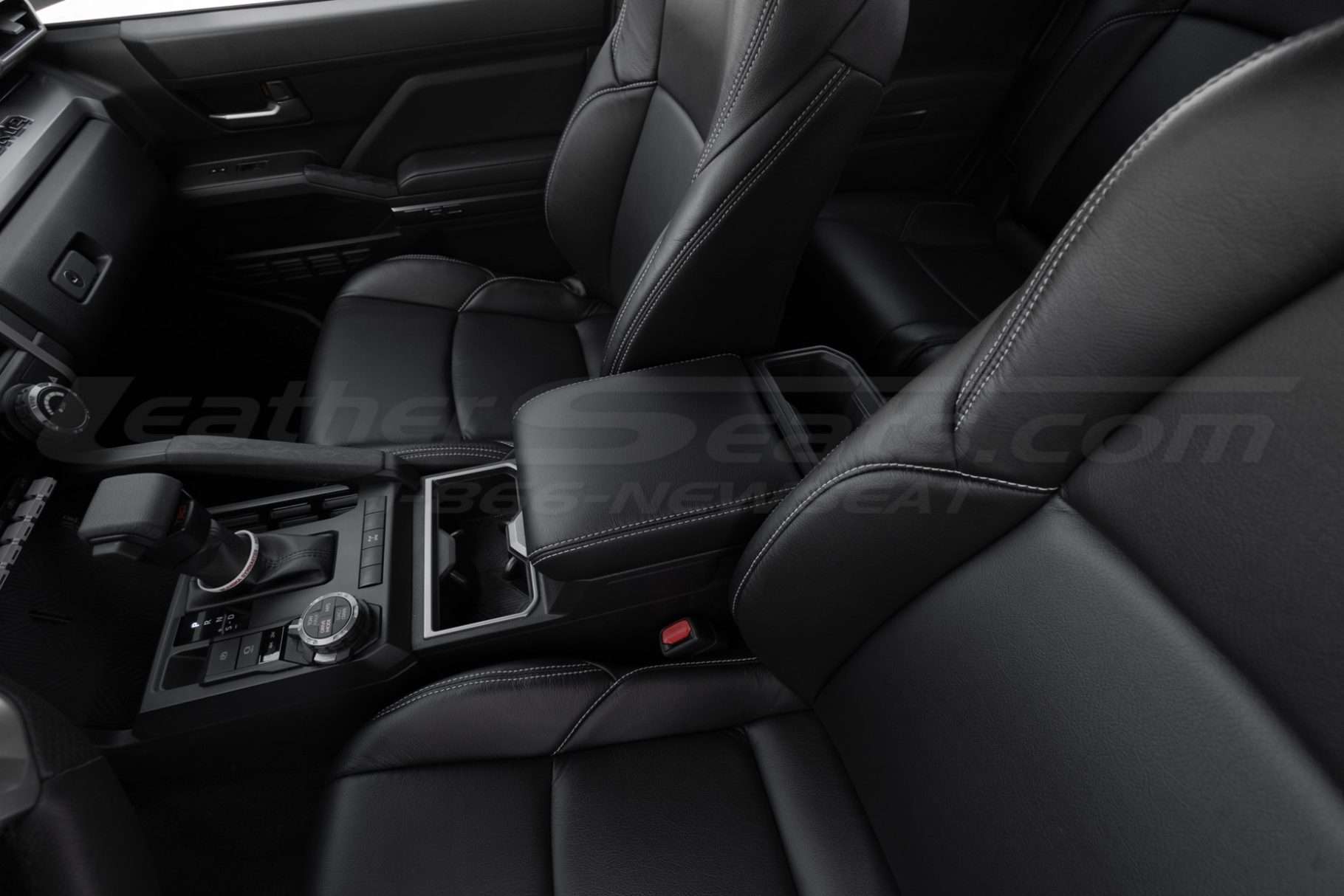 Drive side wide view of Toyota Tacoma leather console lid cover installed