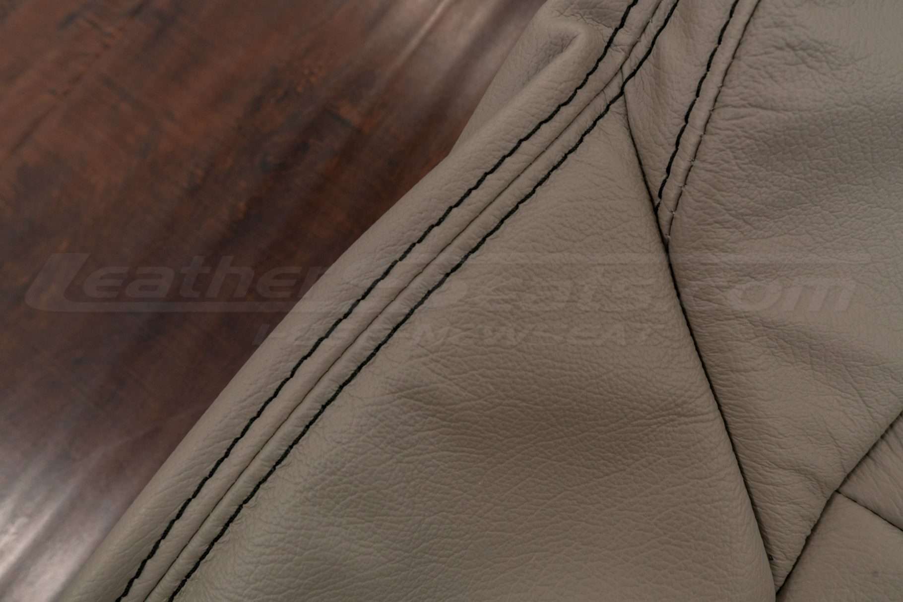 Contrasting Black stitching on Beach leather