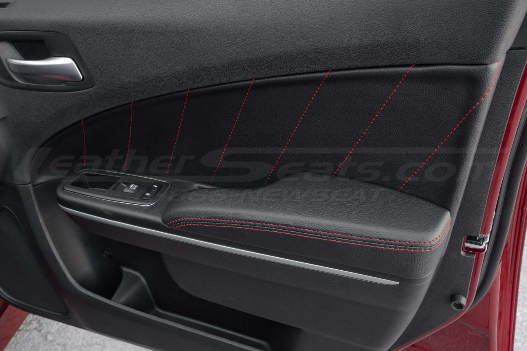 Dodge Charger Sedan with leather door armrest covers installed- front passenger door