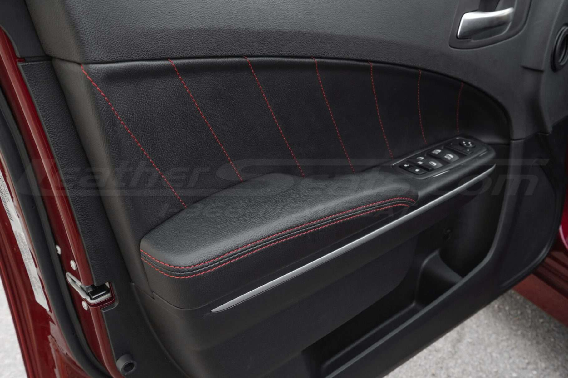 Dodge Charger Installed custom door armrest with black leather and red stitching