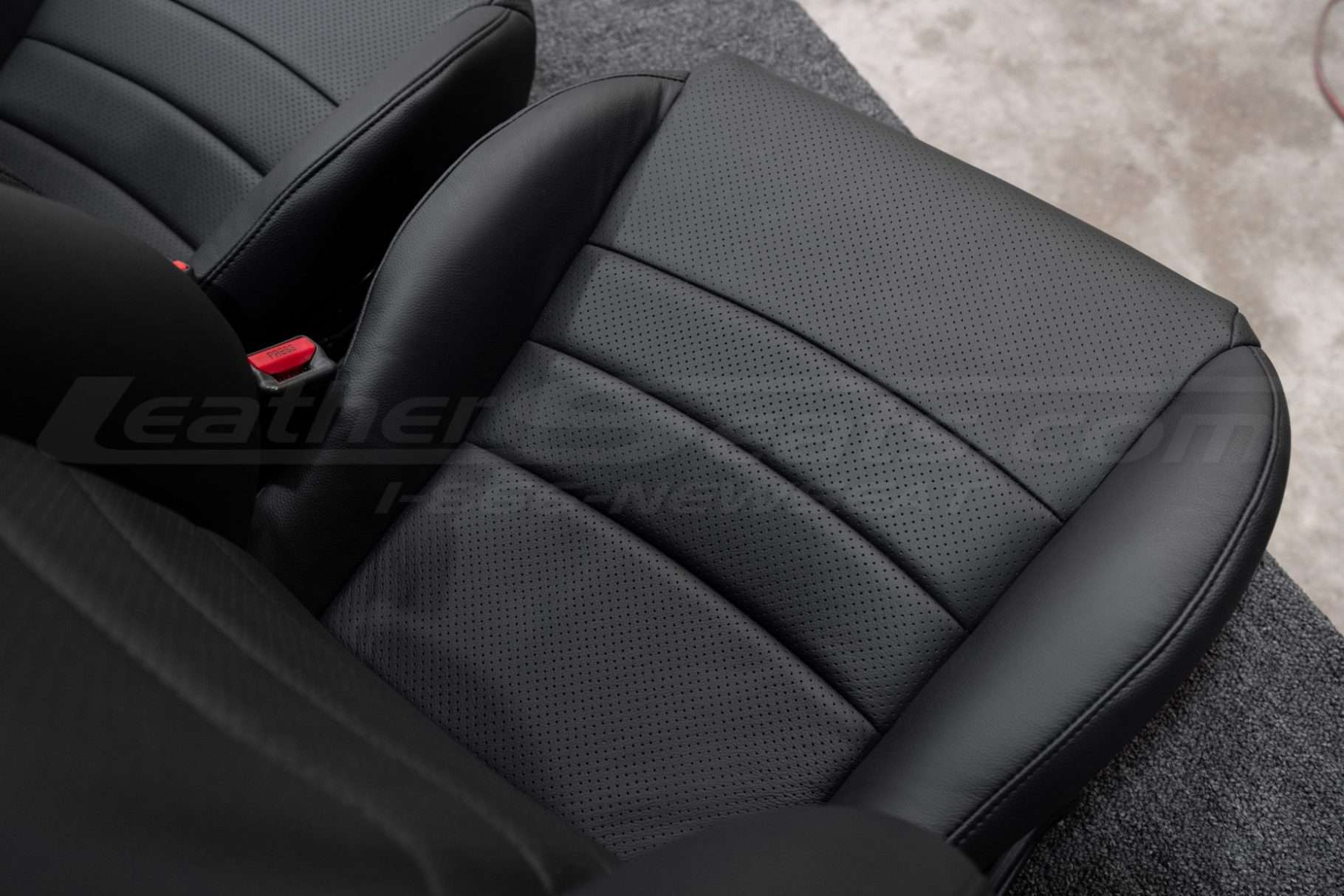 Body perforation on installed leather cushion close-up