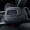 Driver side view of installed leather aftermaket phone charging console lid