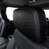 Black Silverado leather headrest close-up with contrasting Lapis double-stitching