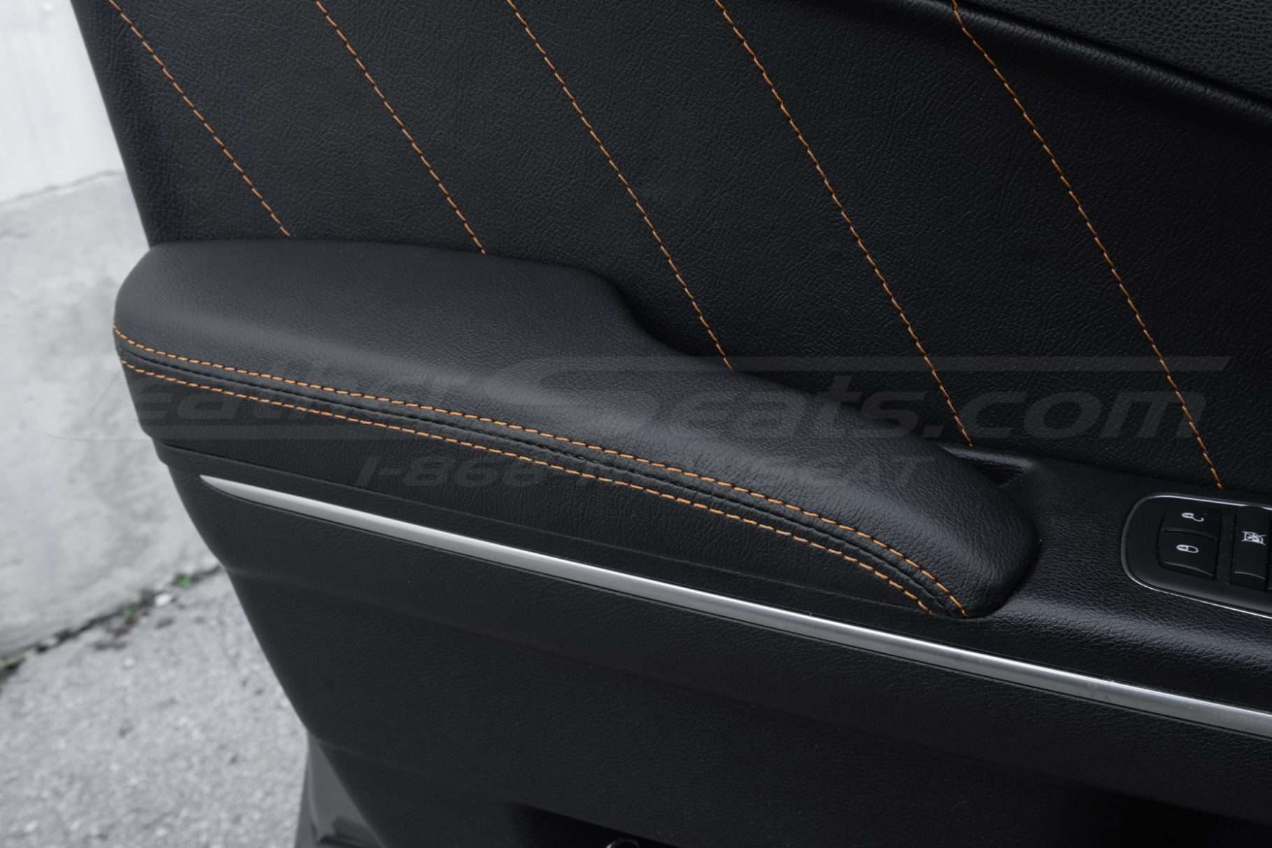 Leather Door Armrest close-up infor Dodge Charger Sedan