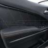 Black leather door inserts and armrests with contrasting orange stitching for dodge charger sedan
