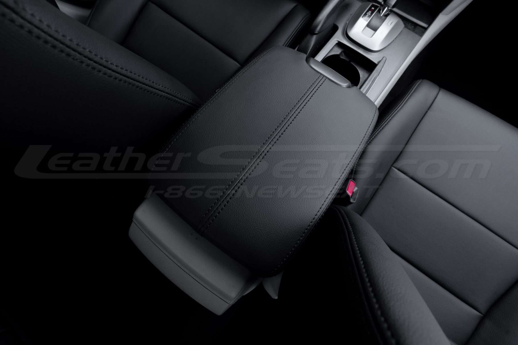 Back passenger view of black installed leather console cover