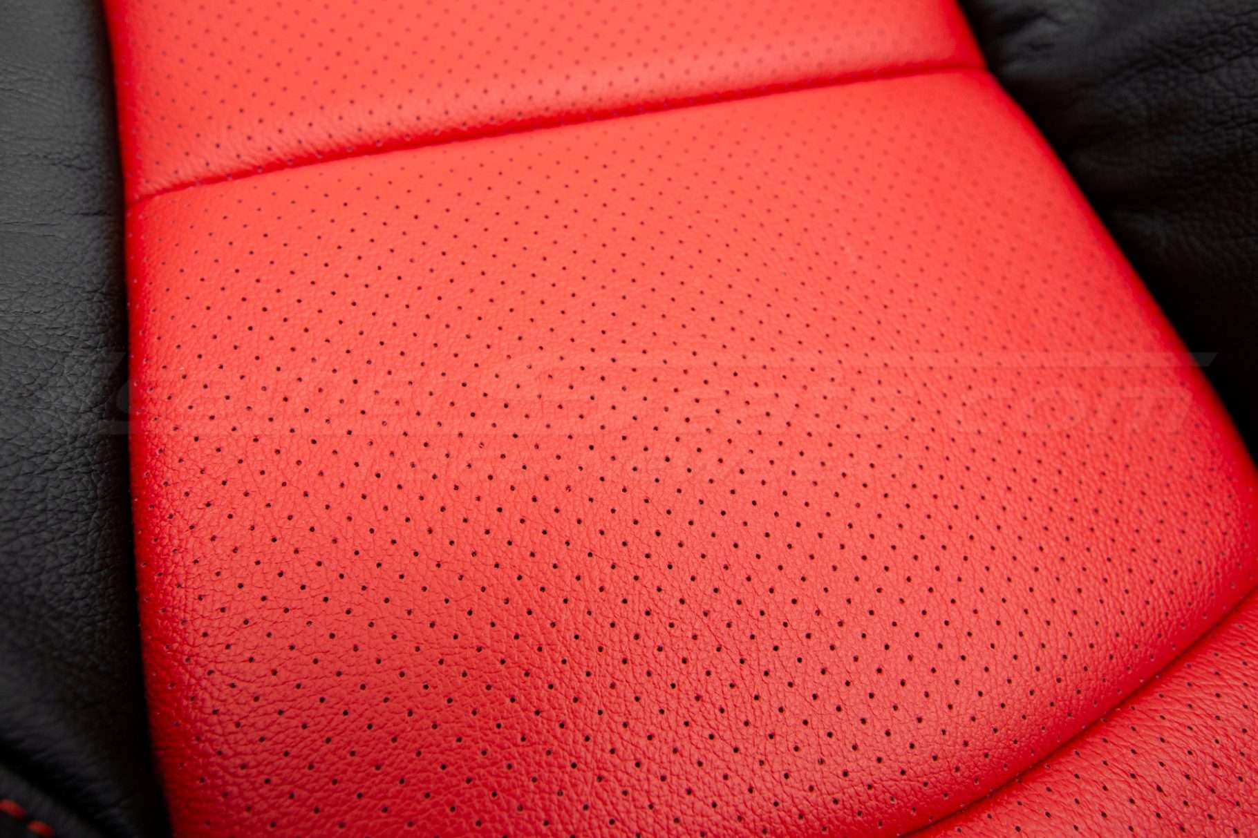 Bright Red perforated combo close-up leather texture