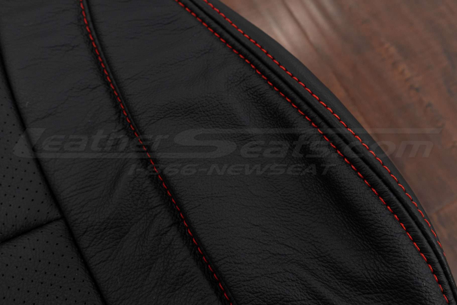 Contrasting Bright Red double-stitching on Black leather
