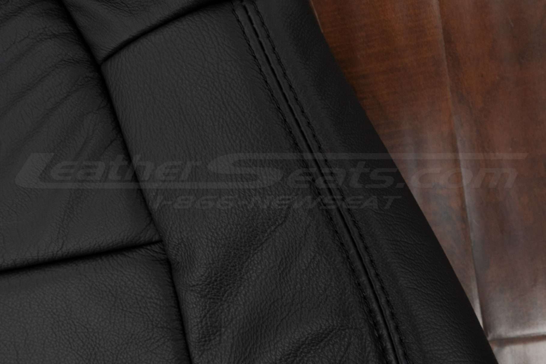 Black double-stitching on Black leather