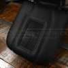 Black leather wireless charging center console lid with grey stitching