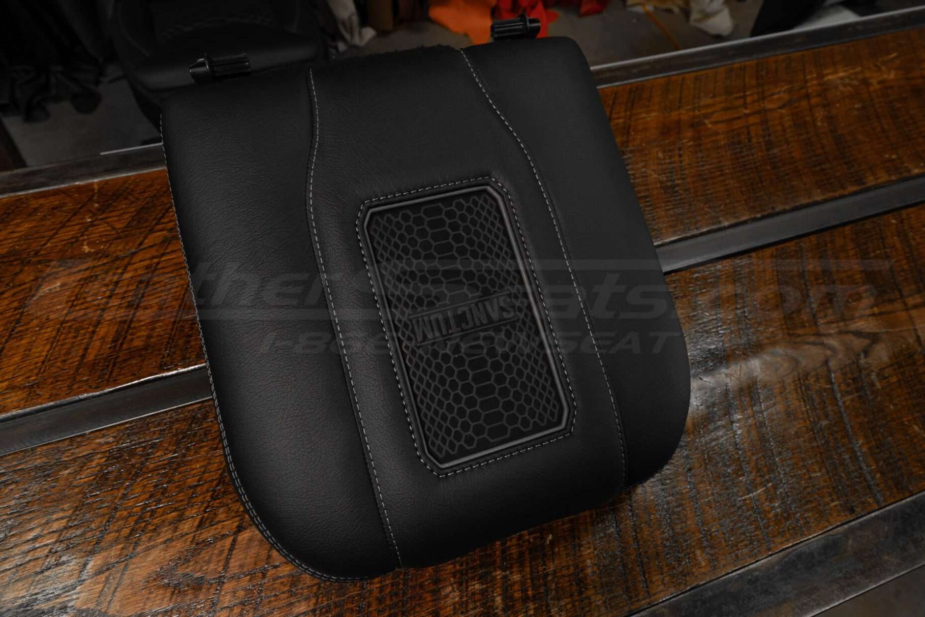 Top-down side view of Sanctum Wireless Leather Charging Center Console Lid for Chevrolet and GMC trucks