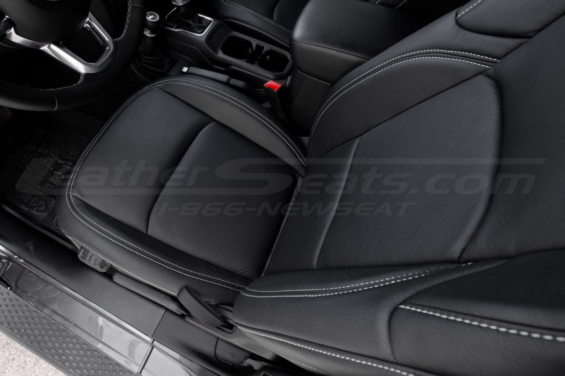 Top-down view of front driver leather seat installed