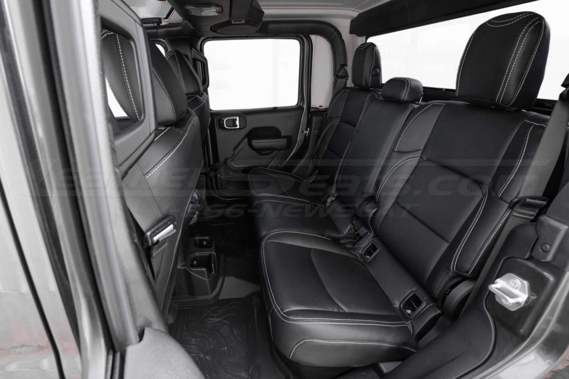 Jeep Gladiator installed rear leather seats with black leather and ice grey double-stitching