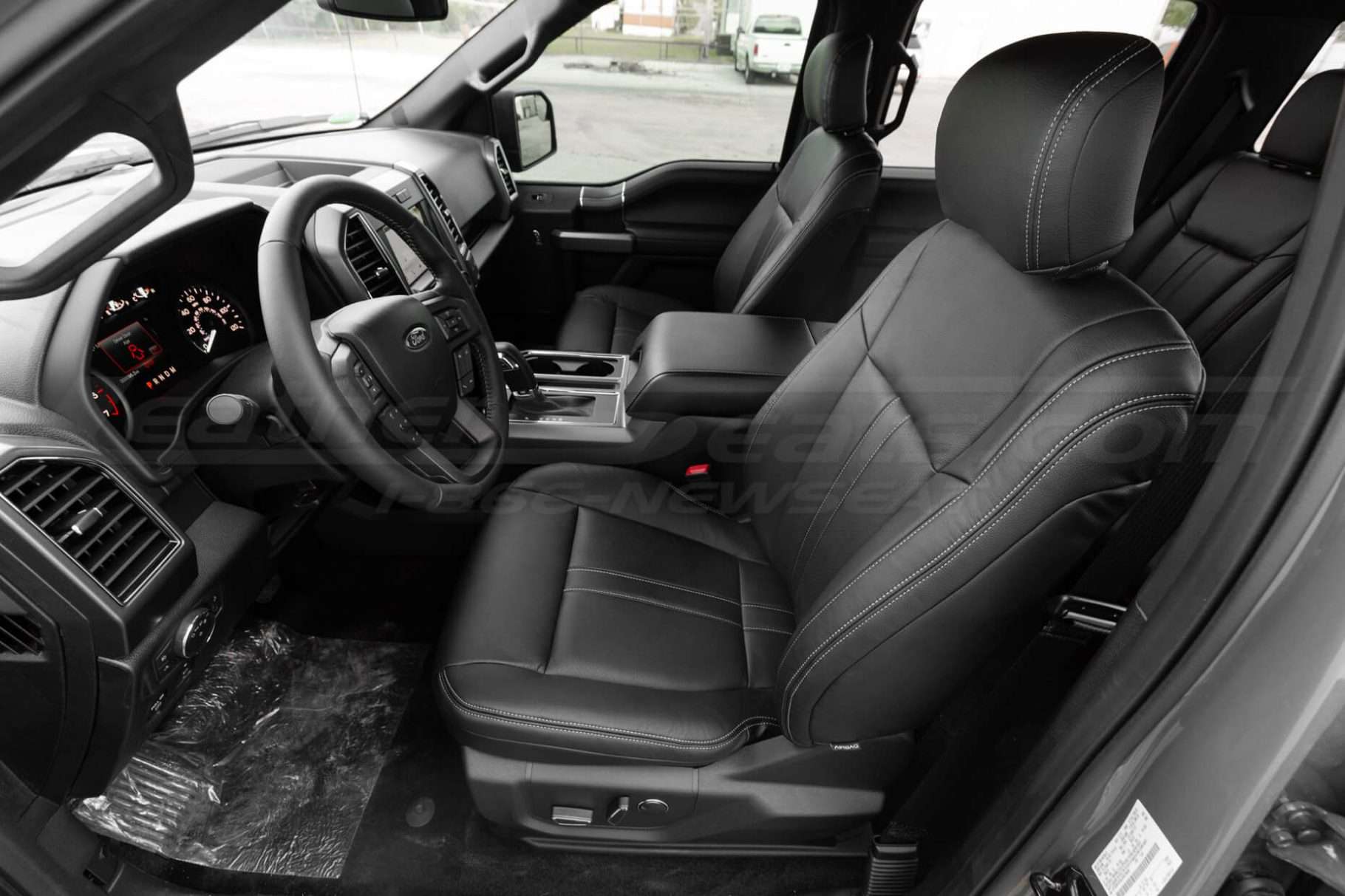 Ford F-150 SuperCrew with custom Black leather seats, perofrated inserts and contrasting stone stitching - front driver seat