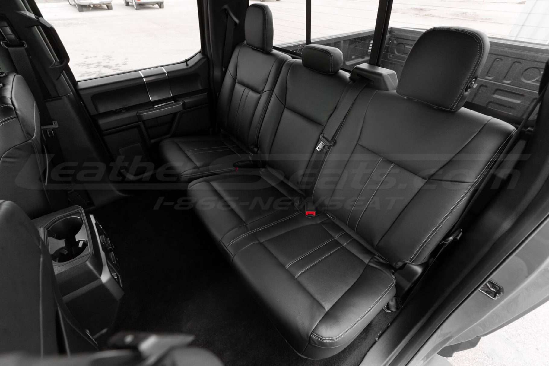 2015-2020 Ford F150 with aftermarket black leather seats installed - Rear seats driver side