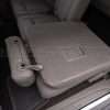 Middle row Ford Expedition fold down seat with custom leather upholstery