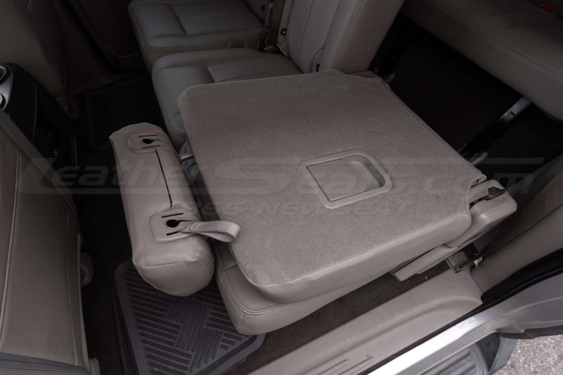 Middle row Ford Expedition fold down seat with custom leather upholstery