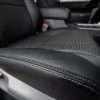 Platinum double-stitching on Black leather seat cushion close-up