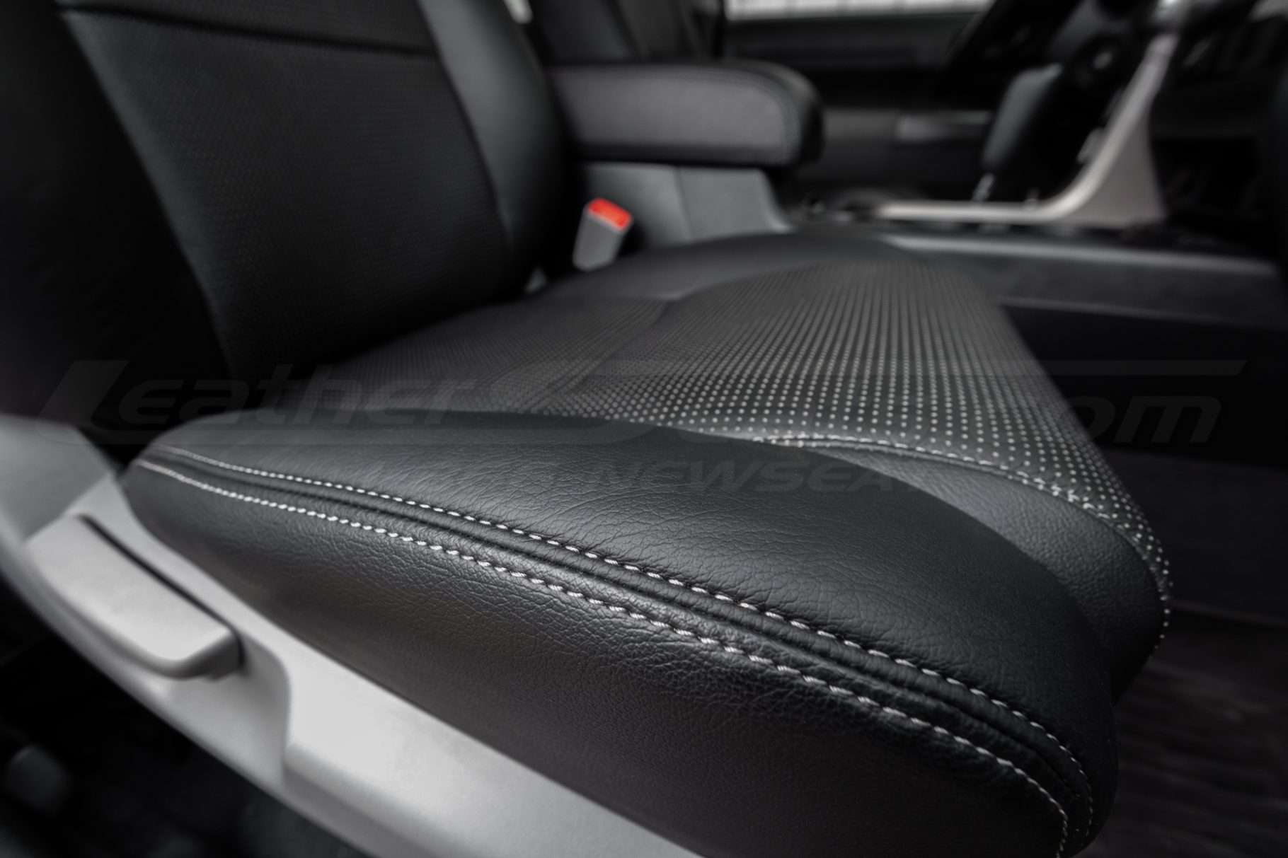 Platinum double-stitching on Black leather seat cushion close-up