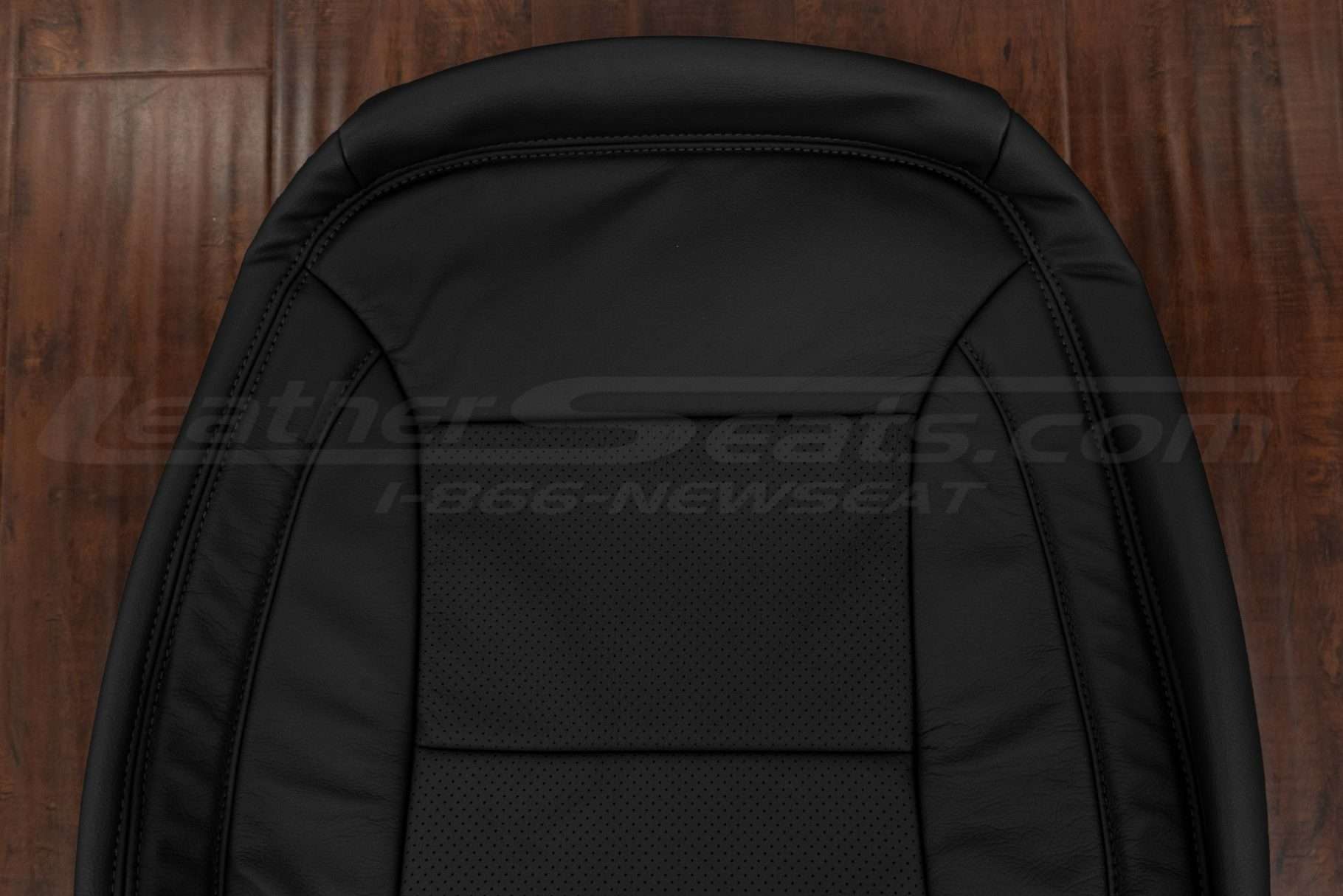 Upper section of black leather upholstery