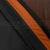Contrasting silver stitching on black and orange leather
