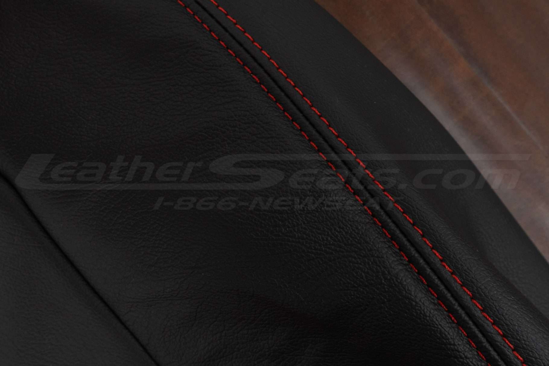 Contrasting Bright red stitching on Black leather