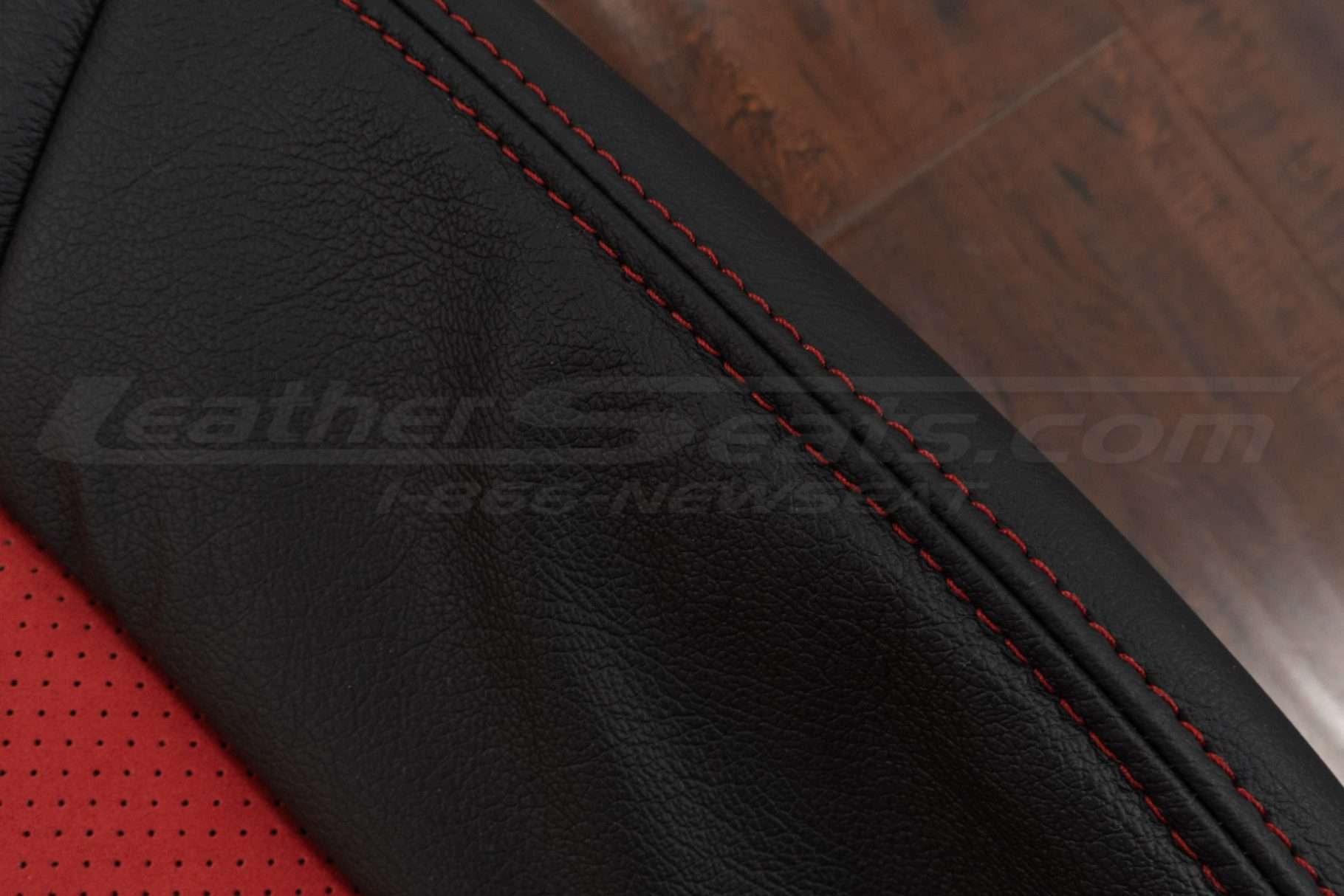 Contrasting Red double-stitching on Black leather