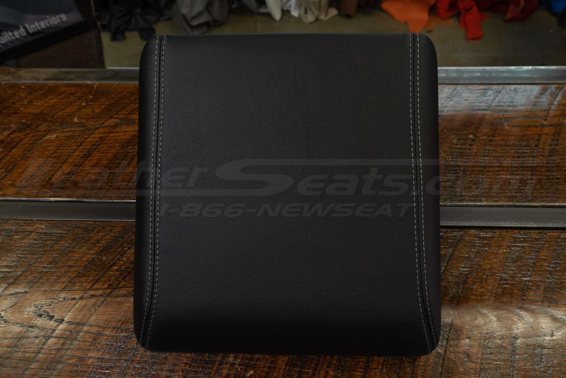 Top-down flat on of custom leather console lid cover