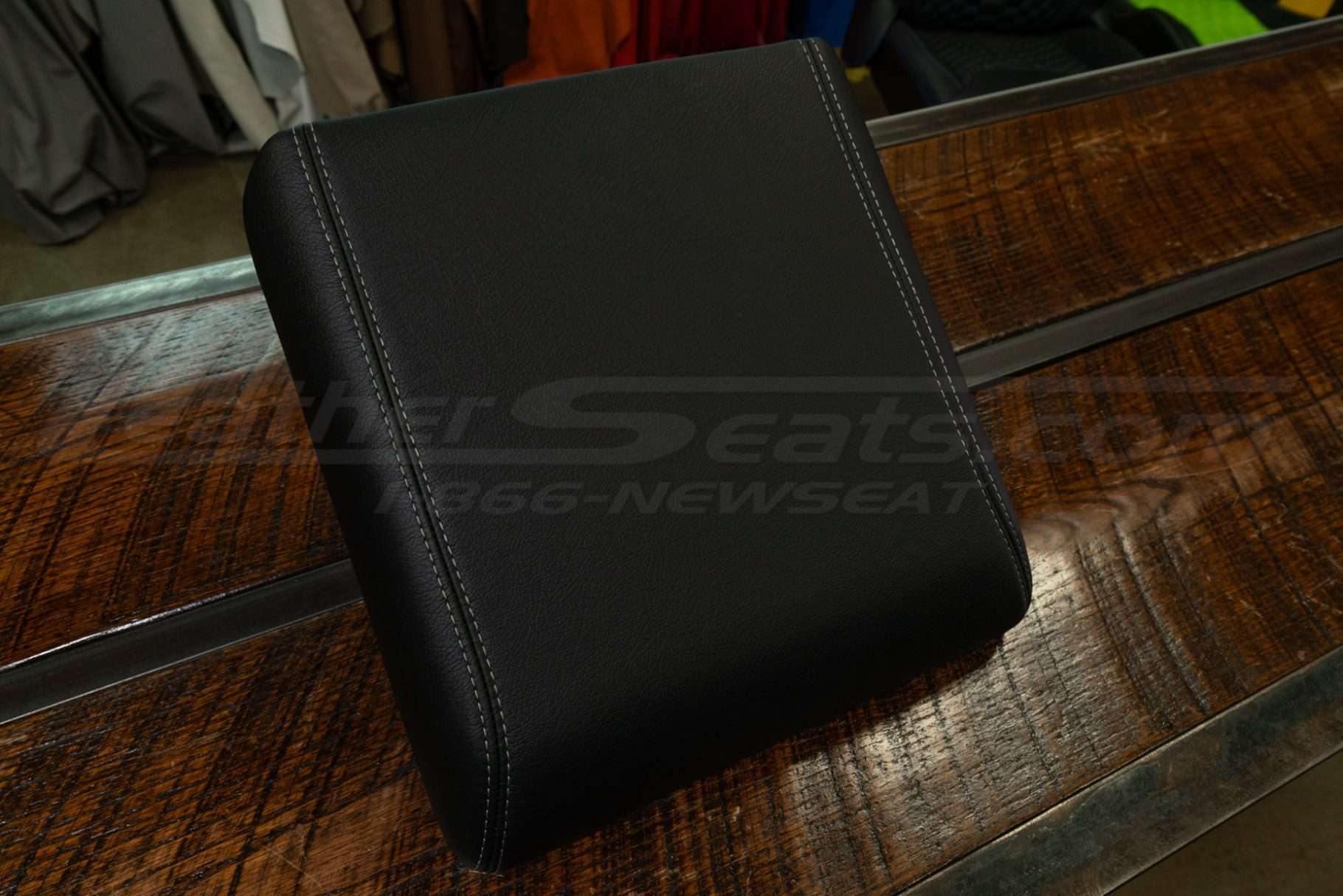 2021-2024 Ford F-150 aftermark console lid cover installed in black leather