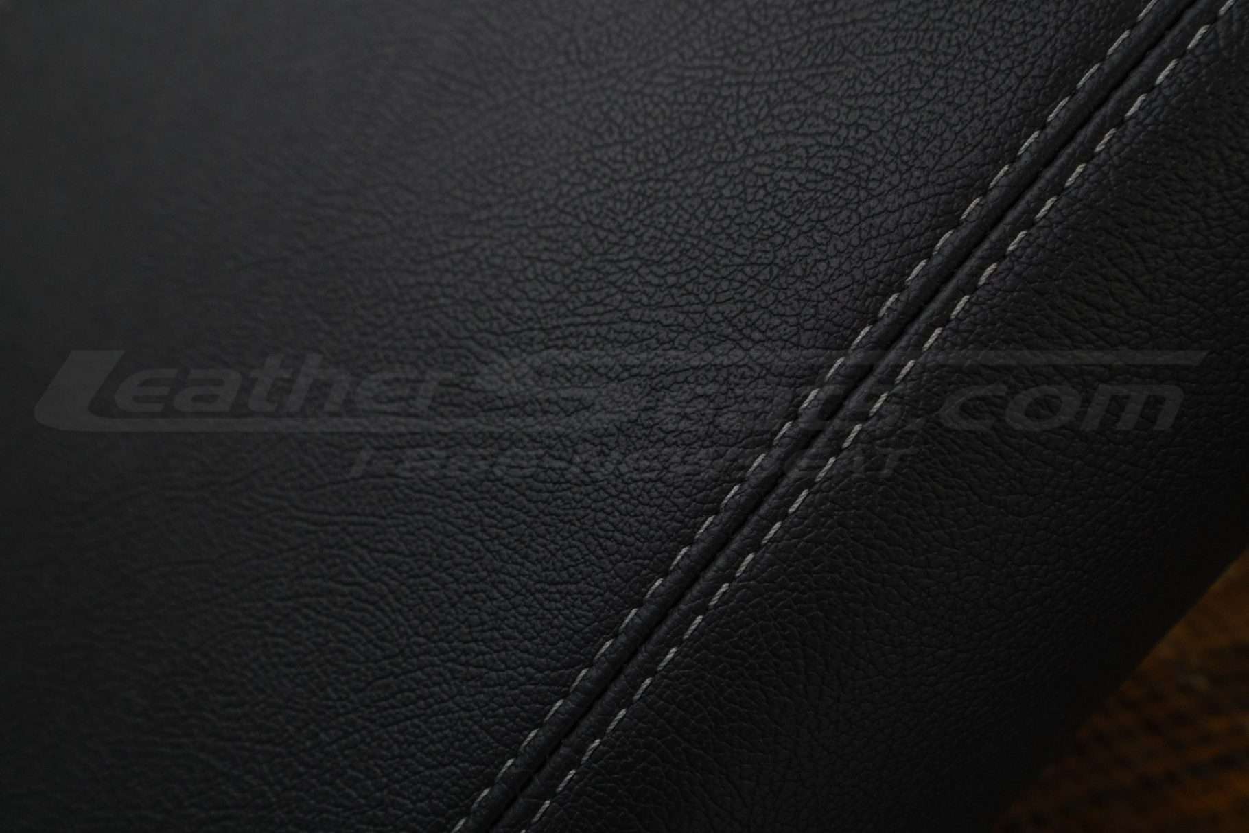 Contrasting Stone double-stitching on Black leather