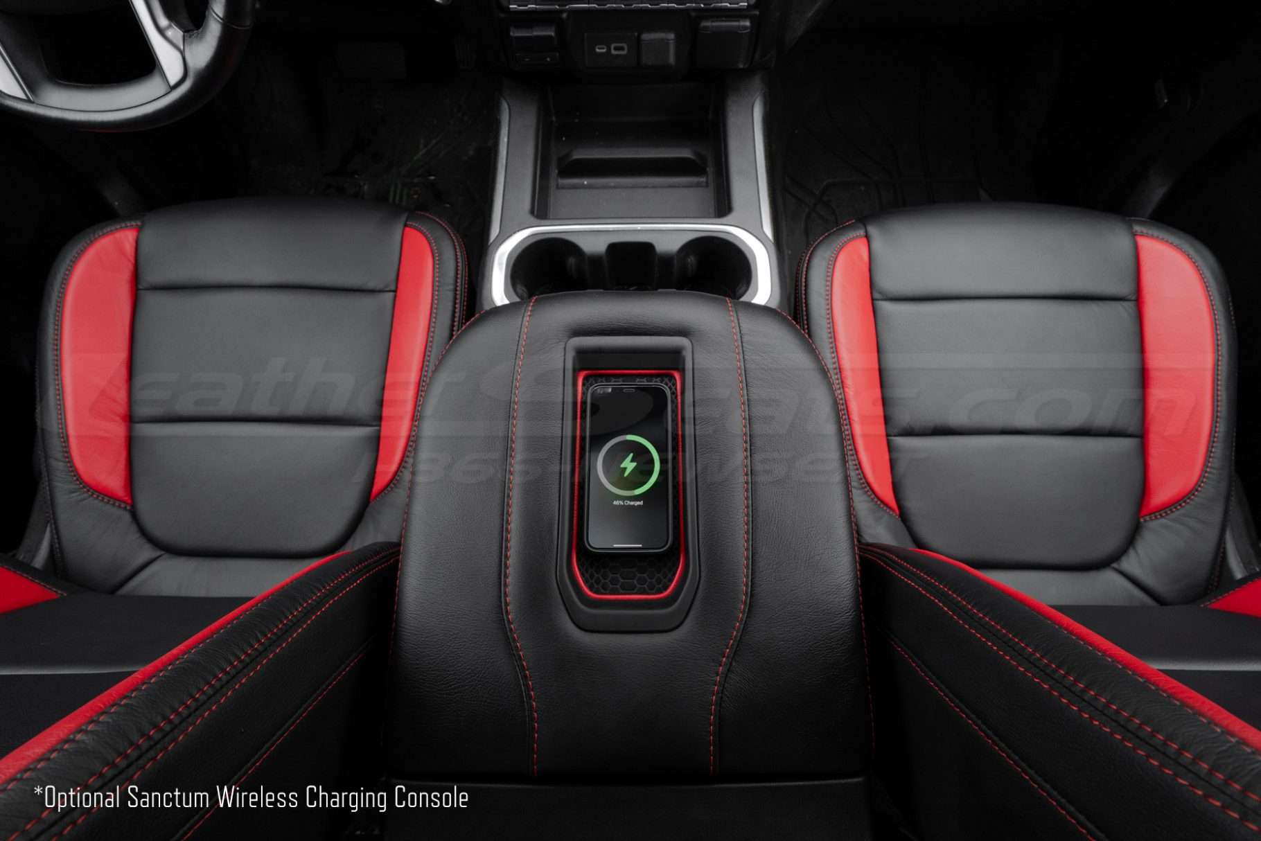 Top-down view of wireless phone charging console charging an iphone