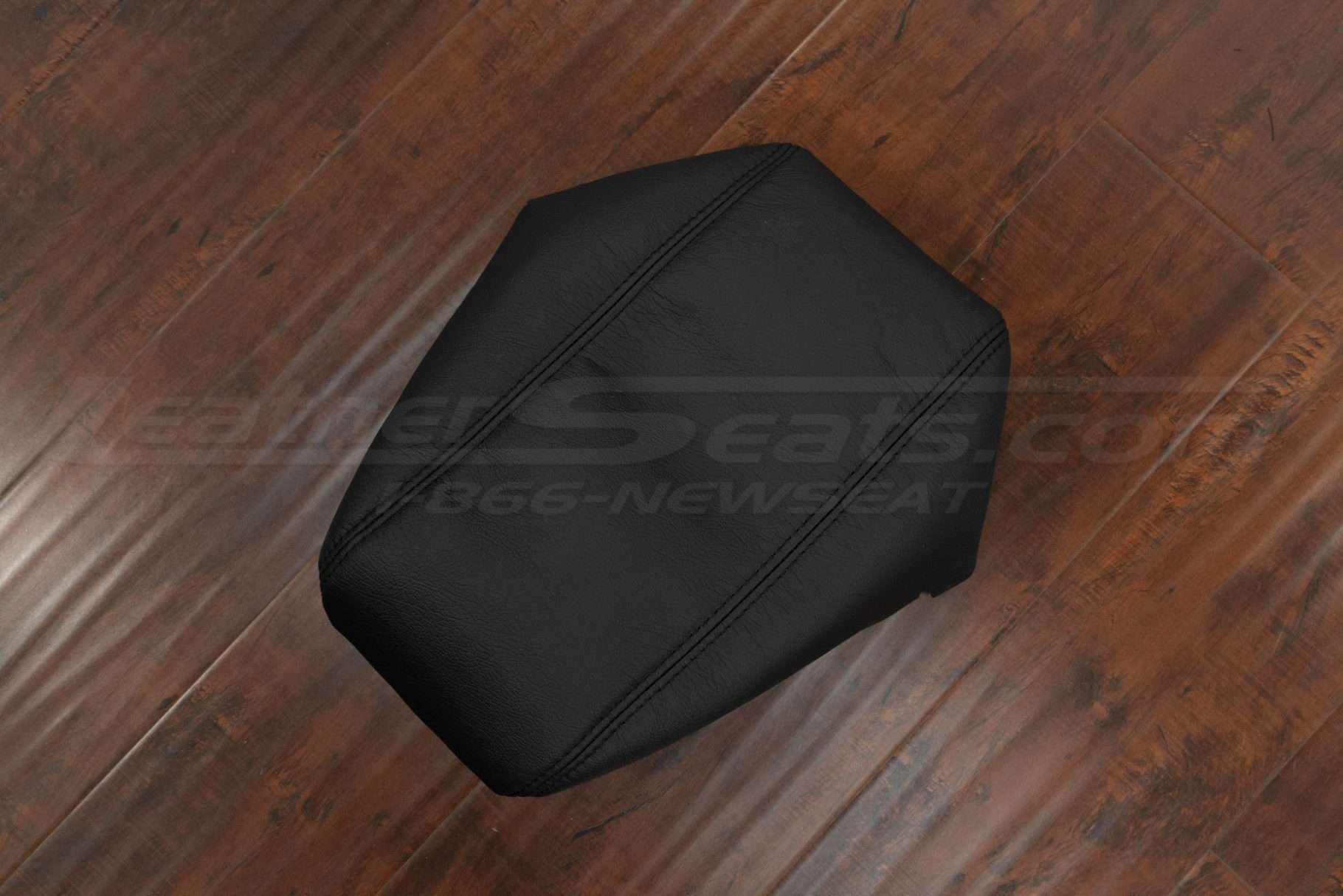 Top-down side view of Black Dodge Durango console lid cover upholstery