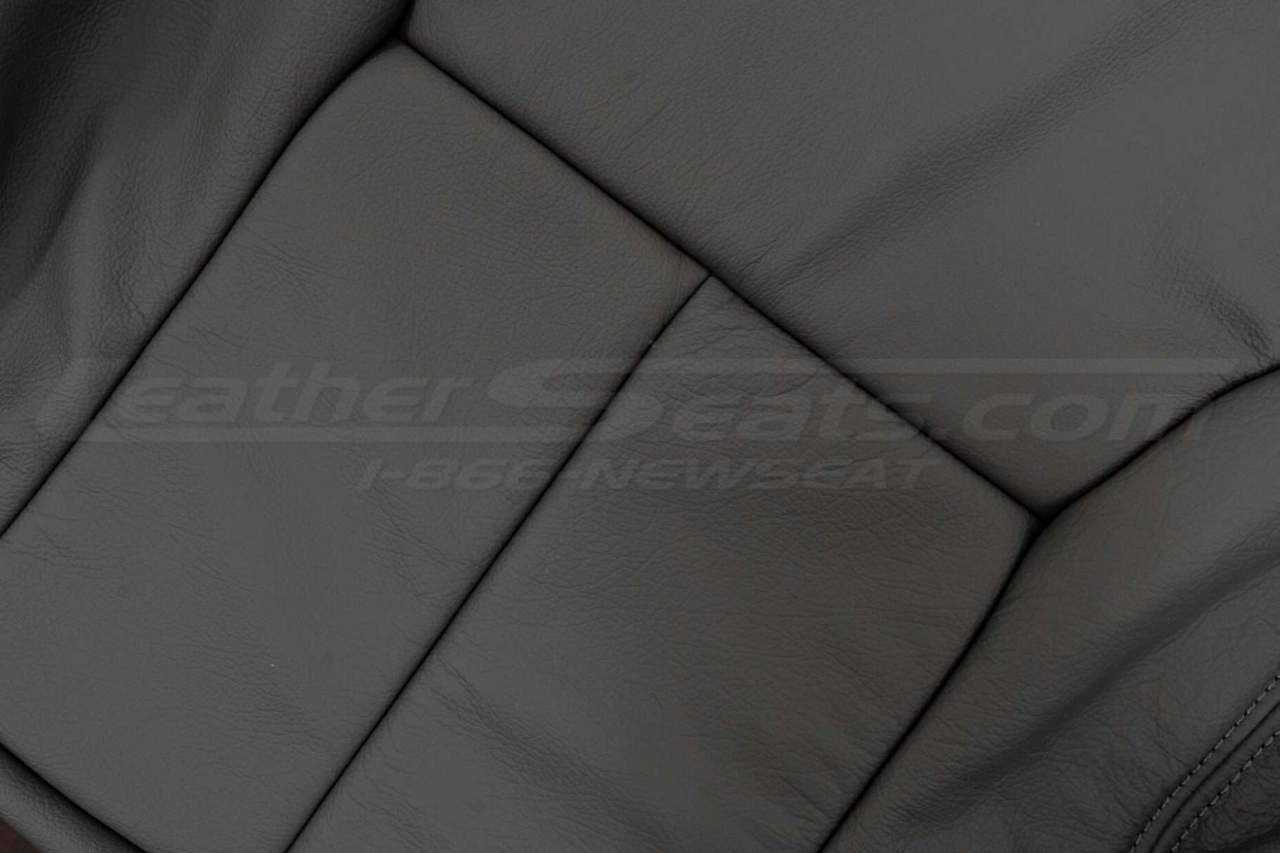 Dodge Ram Club Cab leather backrest close-up - light grey leather texture
