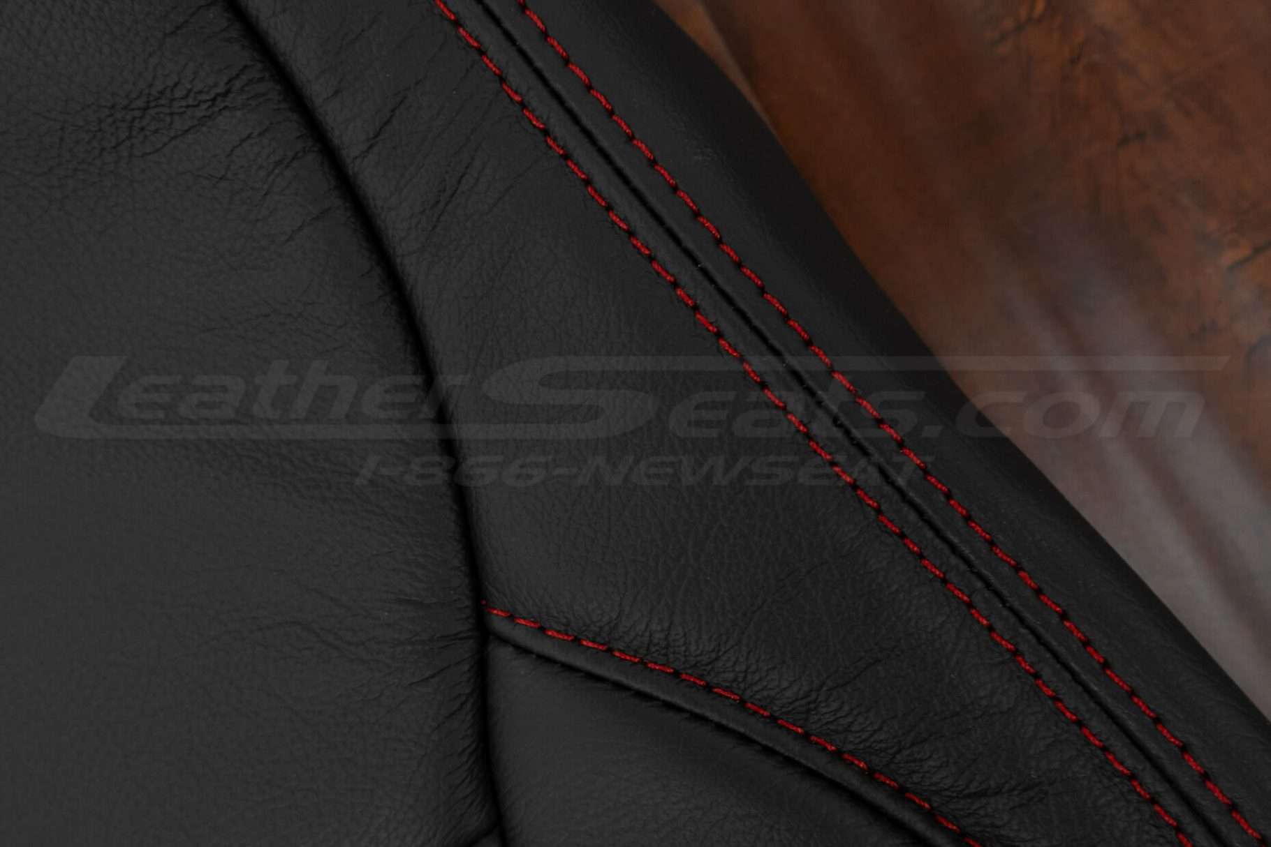 Contrasting Red double-stitching on Black leather